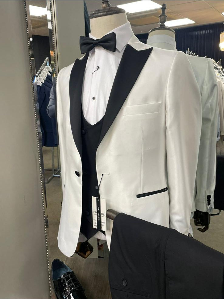 White tuxedo jacket with black vest and bow tie on a mannequin in a store setting.